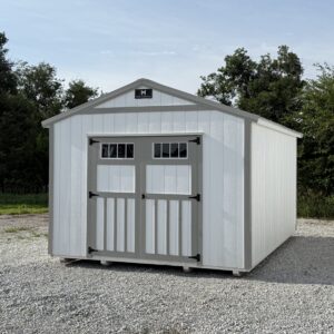 Exterior of white shed with grey trim