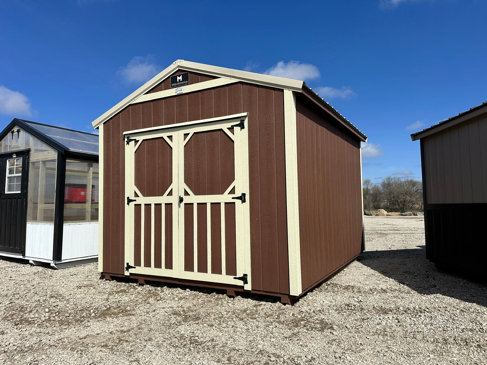 Exterior of small shed with double doors.