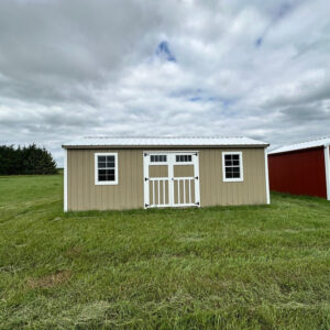 Exterior of large garden shed with double doors and two windows.