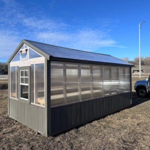 Exterior view of a standard, long greenhouse