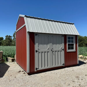 Exterior of red and grey lofted shed