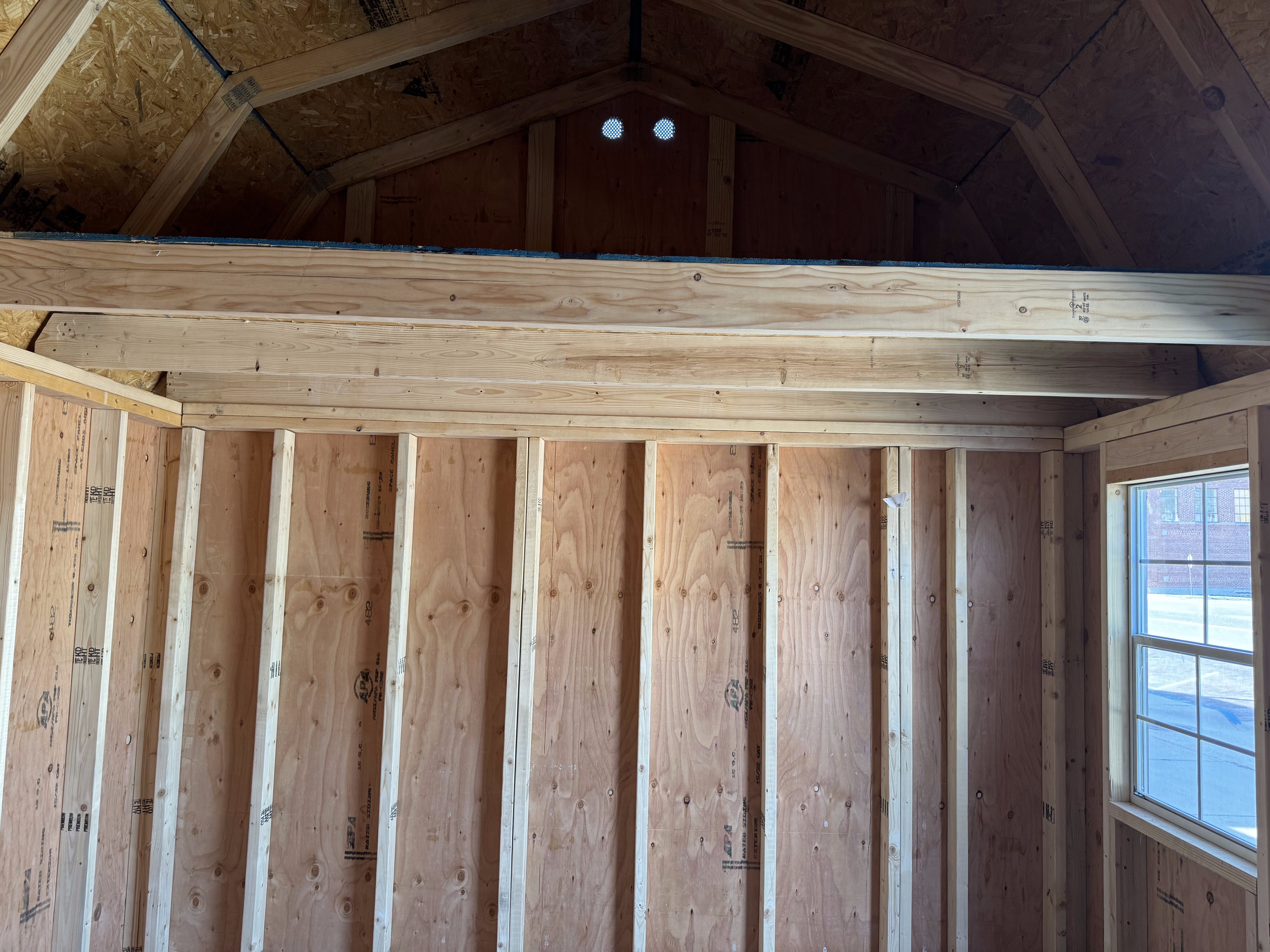 Interior view of the shed, showcasing the lofted area.