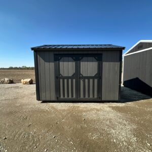 Exterior of small garden shed with double doors on the front.