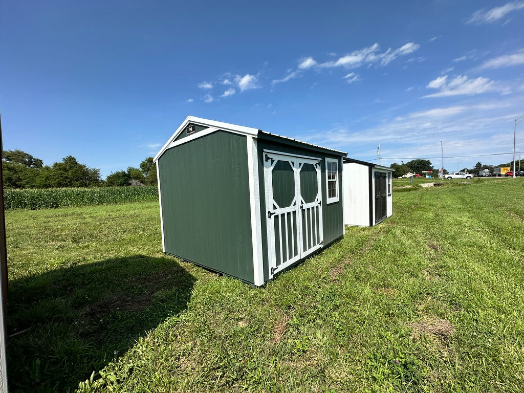 Exterior of small garden shed, highlighting doors.