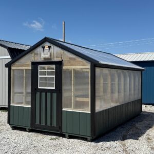Exterior of long greenhouse, showcasing the standard size door on the front