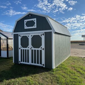 Exterior of barn-styled shed showcasing large doors.